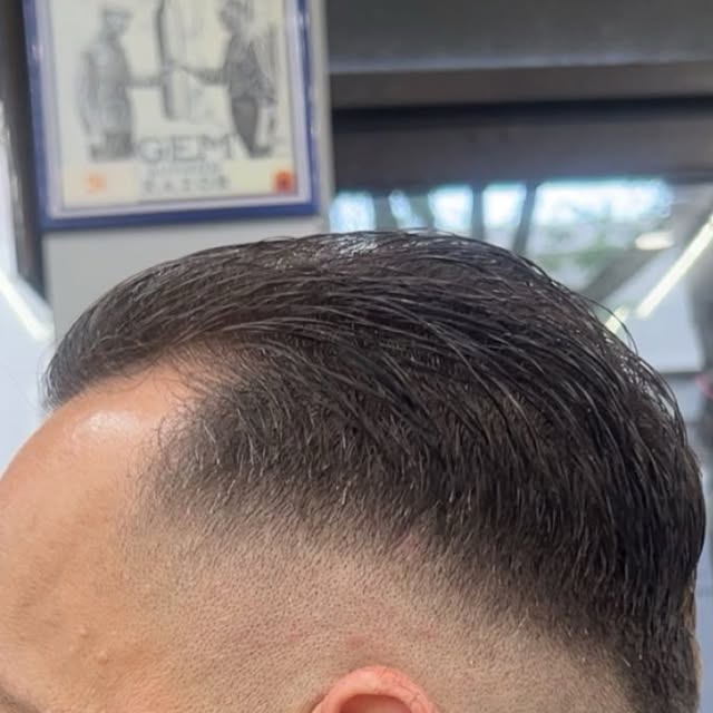 Slicked-back fade at Trim Haus Barbershop, Bronx NYC