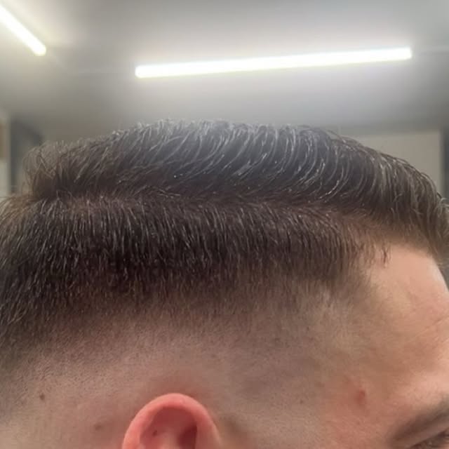 Skin fade with textured top at Trim Haus Barbershop