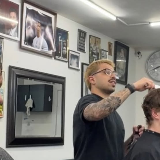 Trim Haus barber cutting hair in the Bronx shop