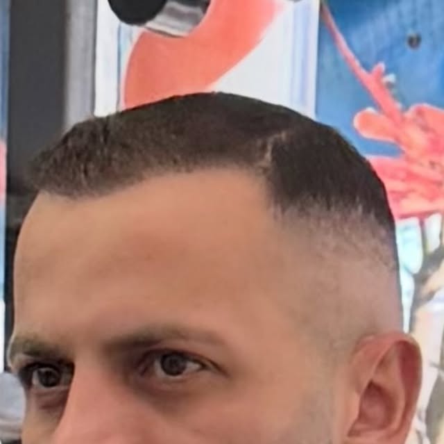 High fade with sharp lineup at Trim Haus Barbershop, Bronx
